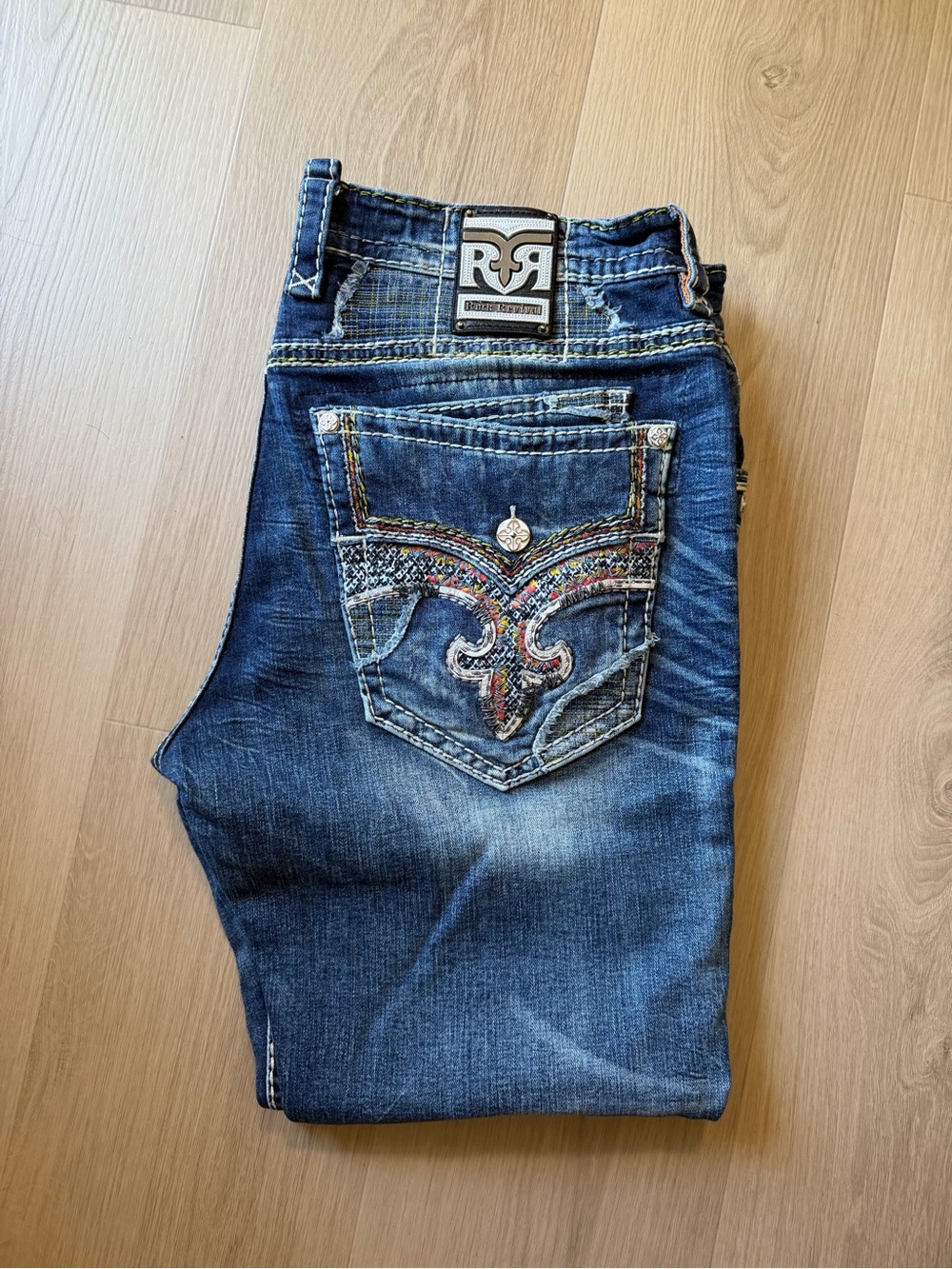 Rock Revival Men's Dark Blue Jeans with Multicolor Embroidered Back Pocket